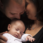 Home. Couple and sleeping baby